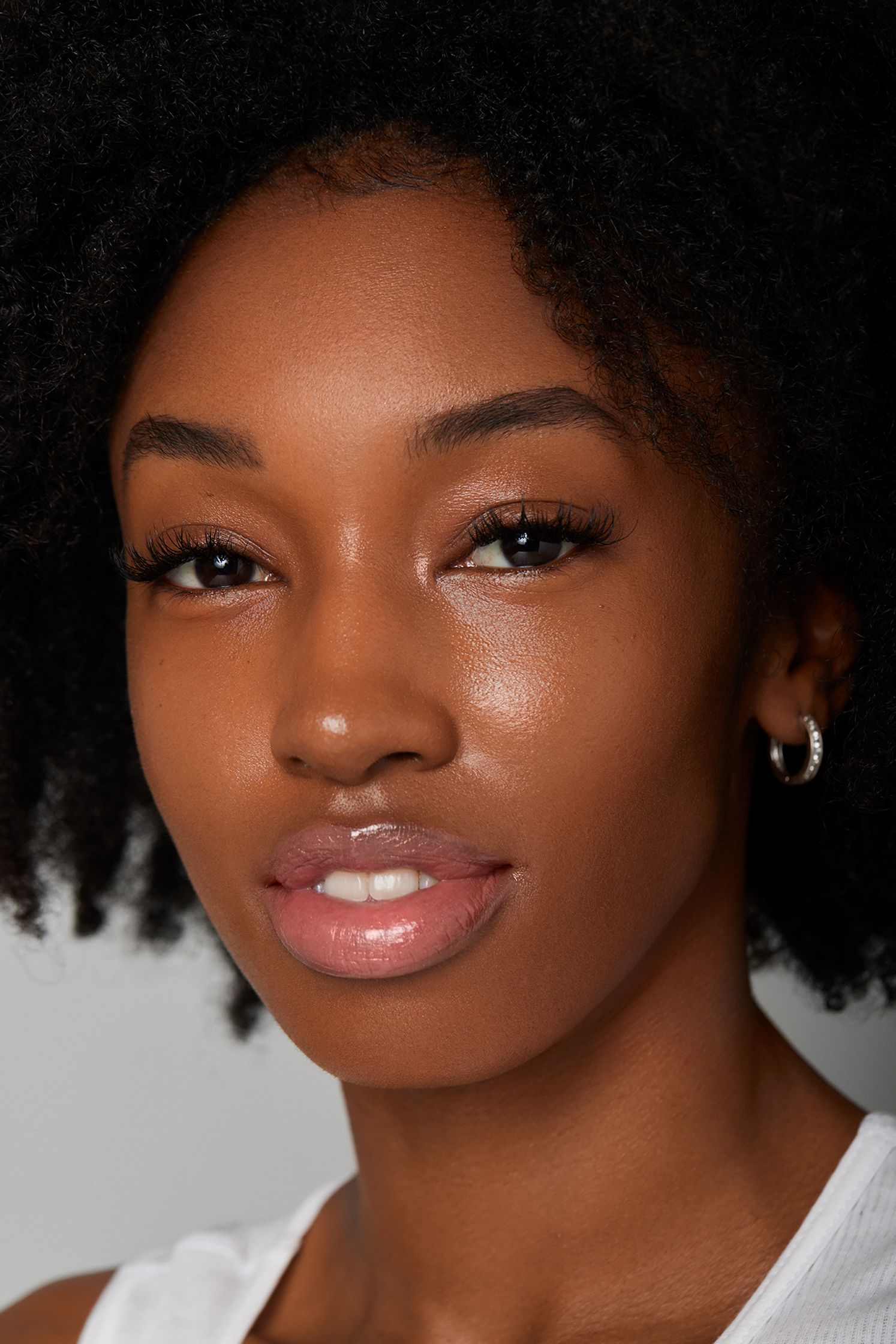 a black woman with afro hair posing for a photo