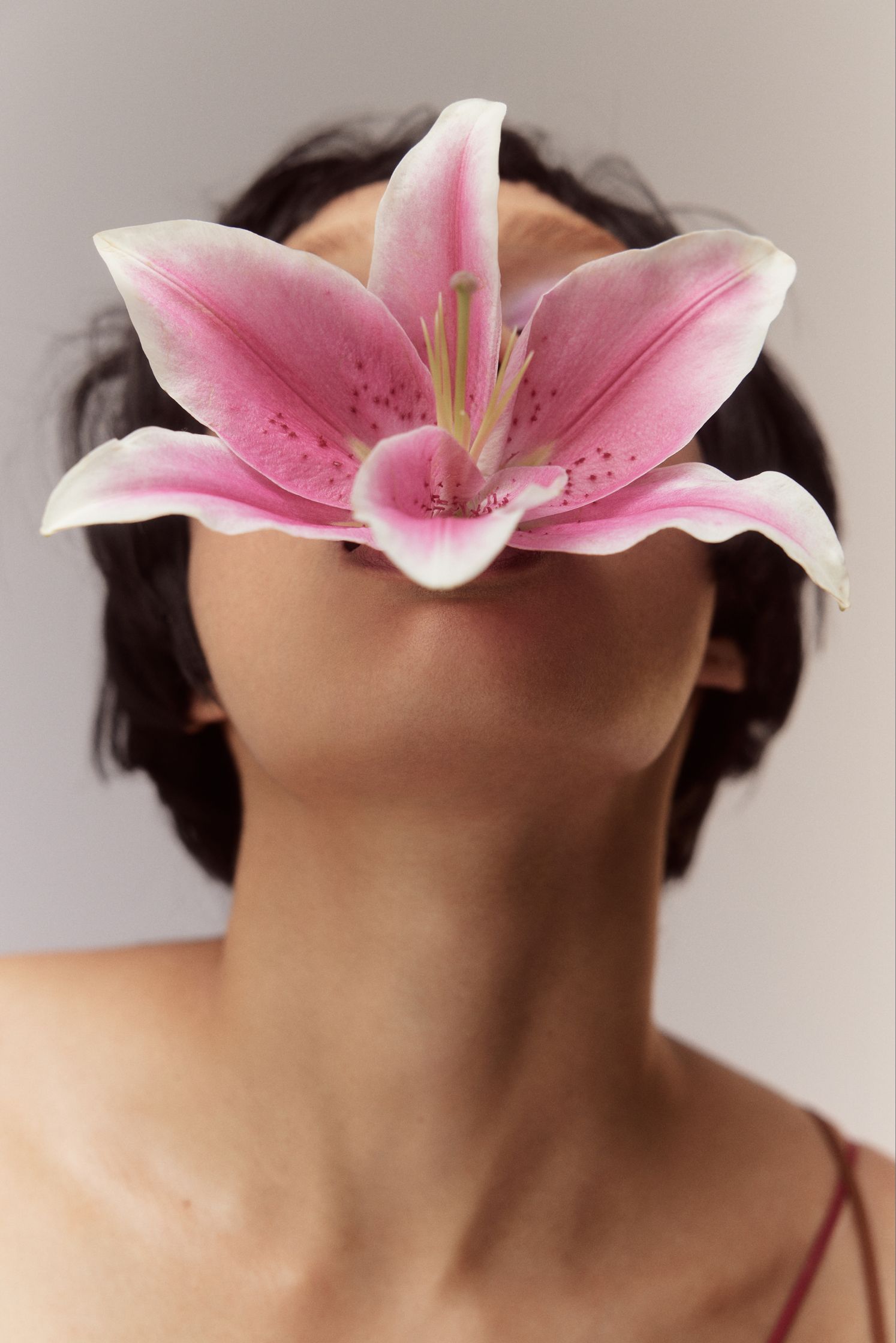 a woman with a flower on her face