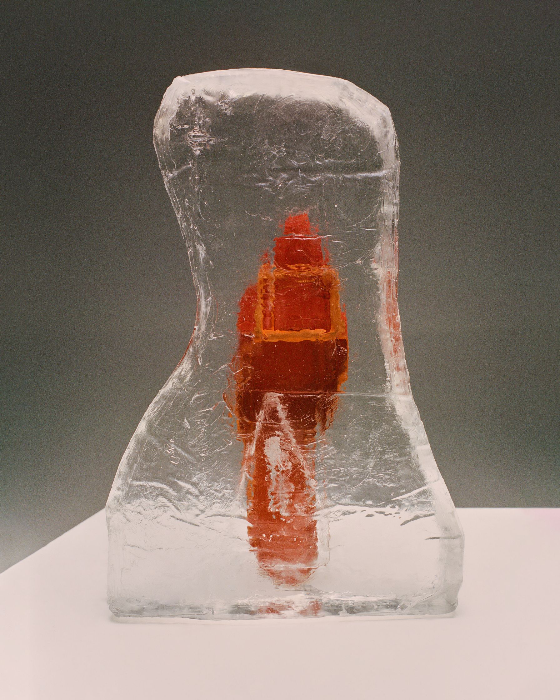an ice sculpture with a red bird on it
