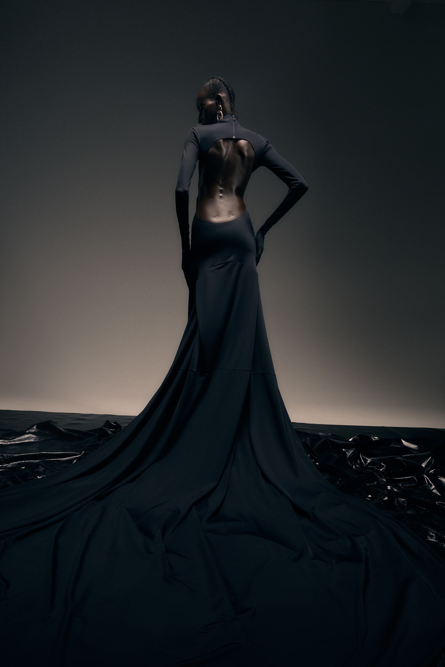the back of a woman in a black dress