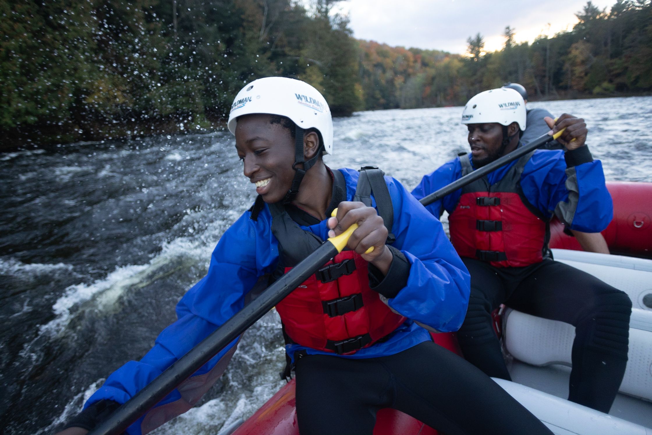 two people rafting down a river