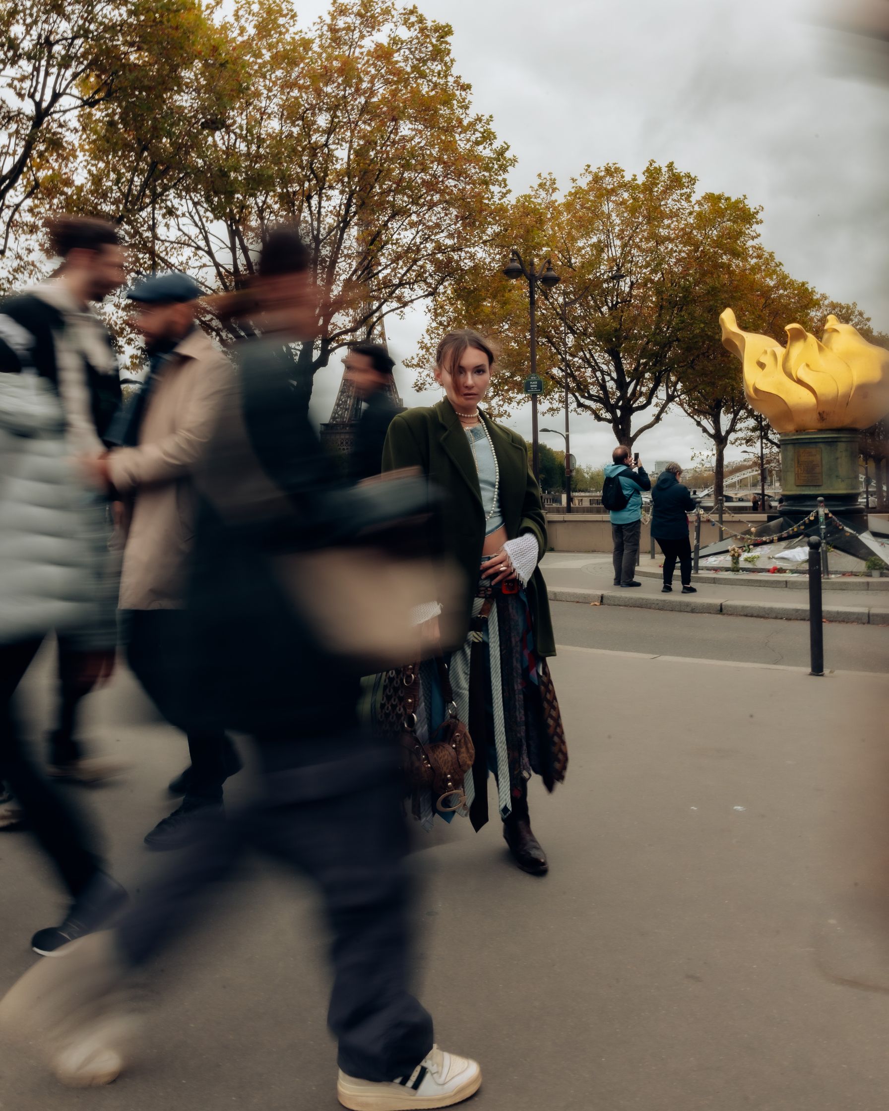 a group of people walking down a street