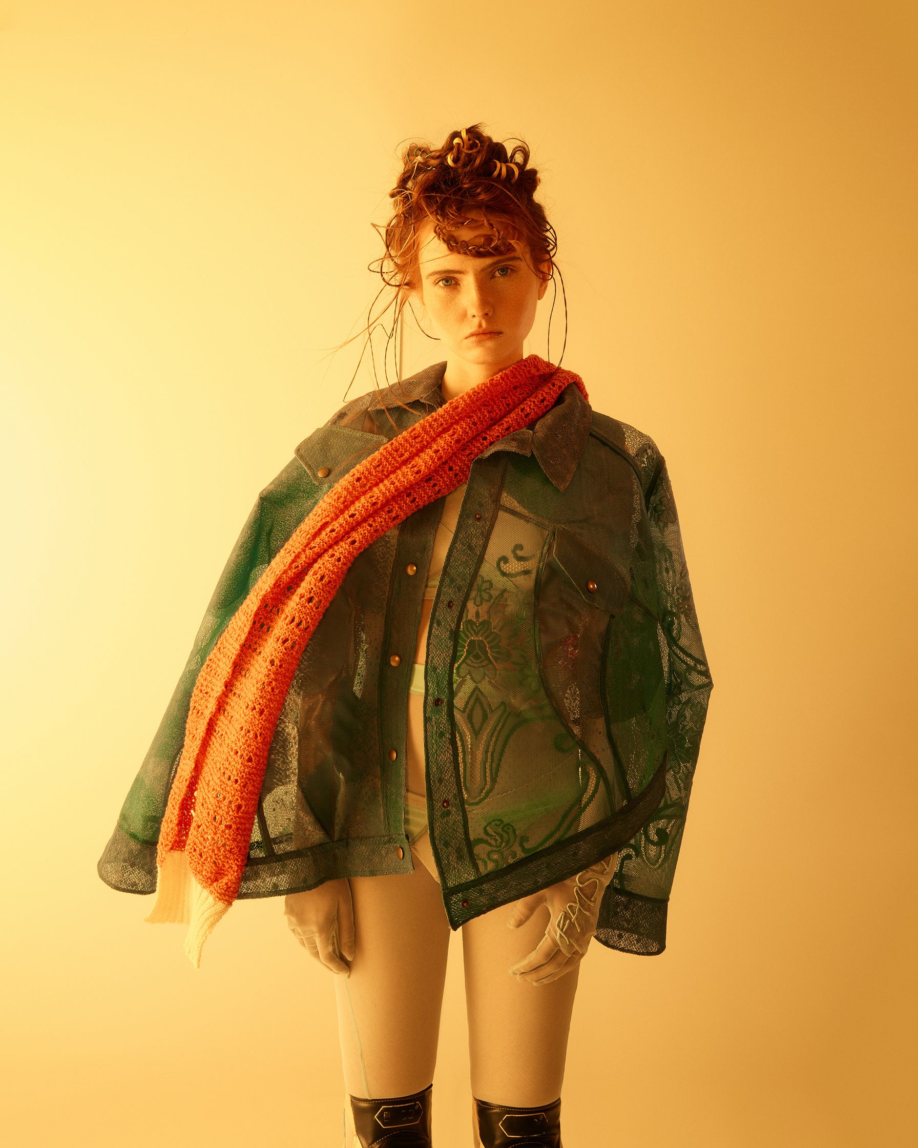 a mannequin wearing a coat and scarf