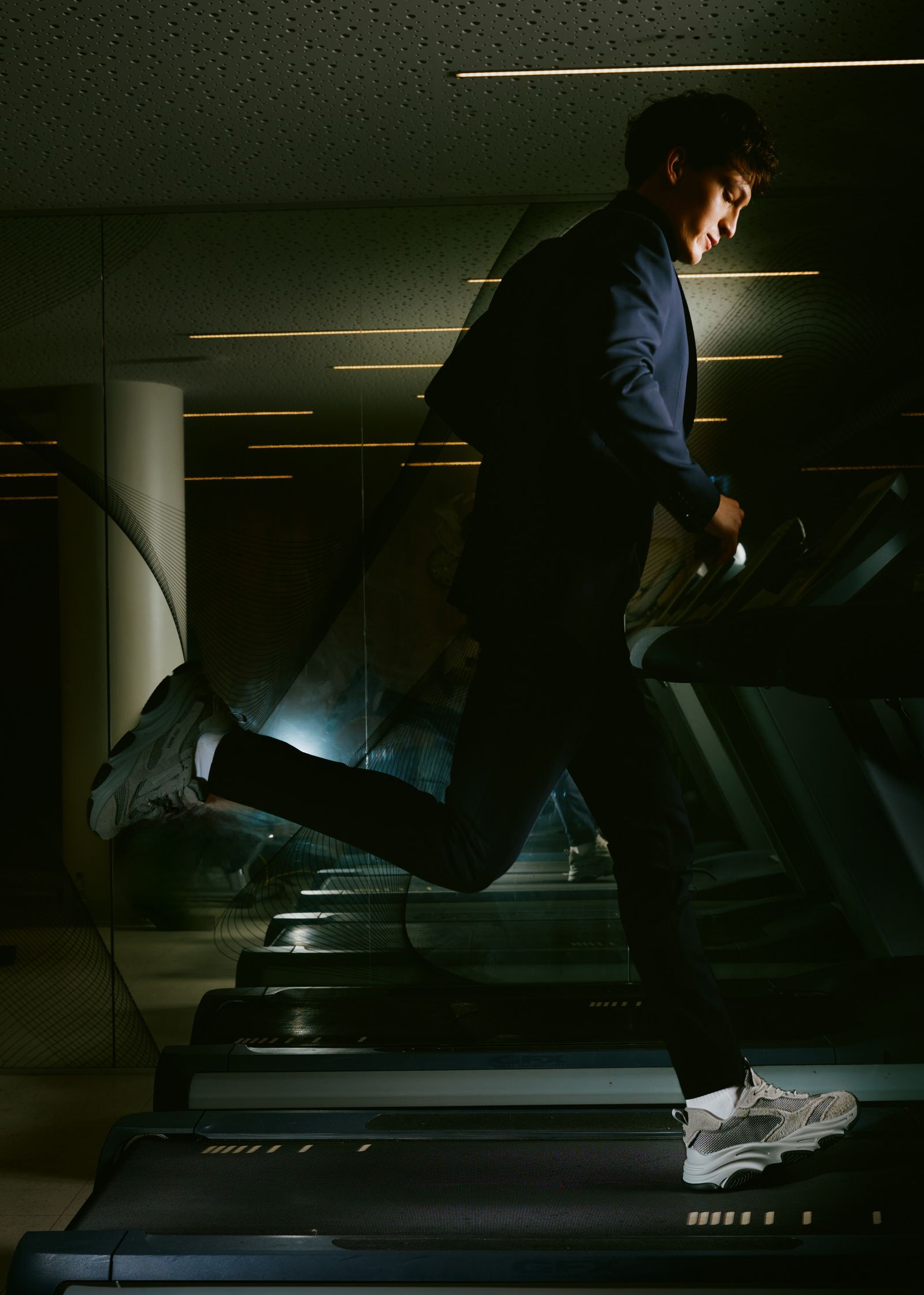 a man is running on a treadmill
