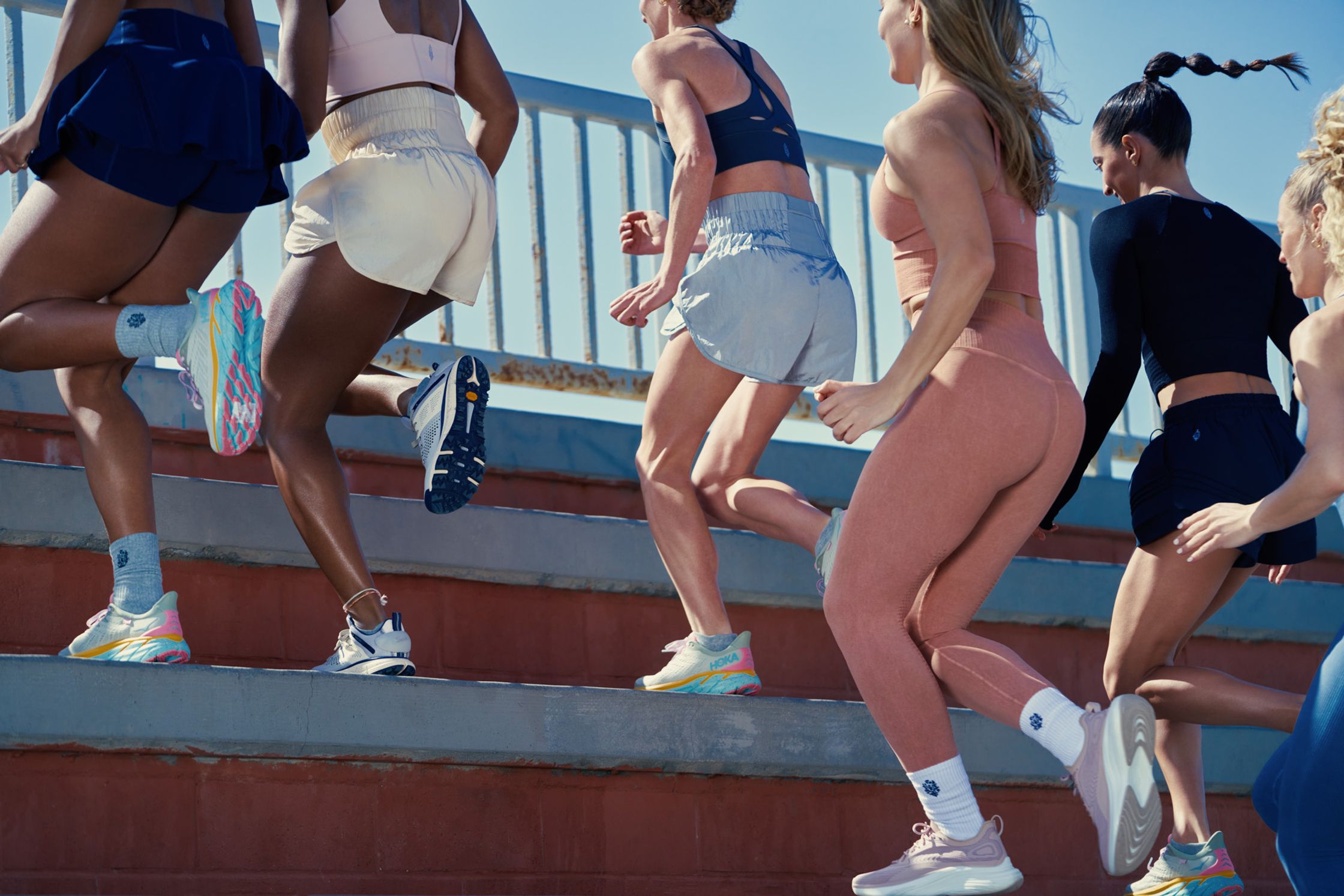 a group of women running on steps