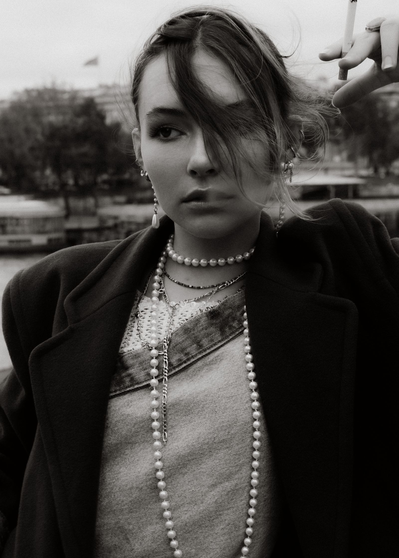 a black and white fashion image 
a lady smoking
