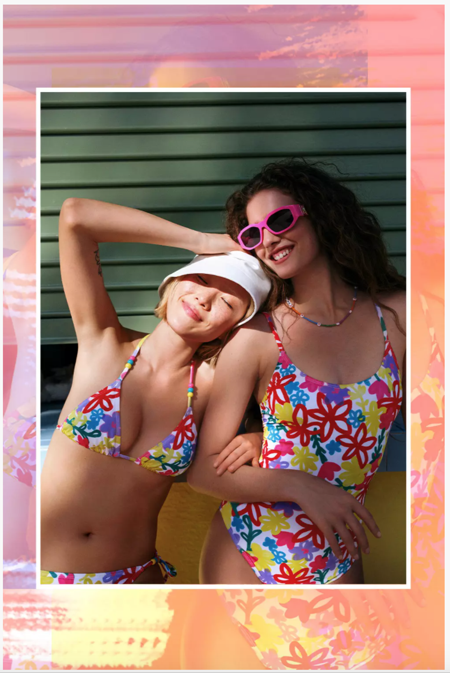 two women in colorful bikinis posing for a photo