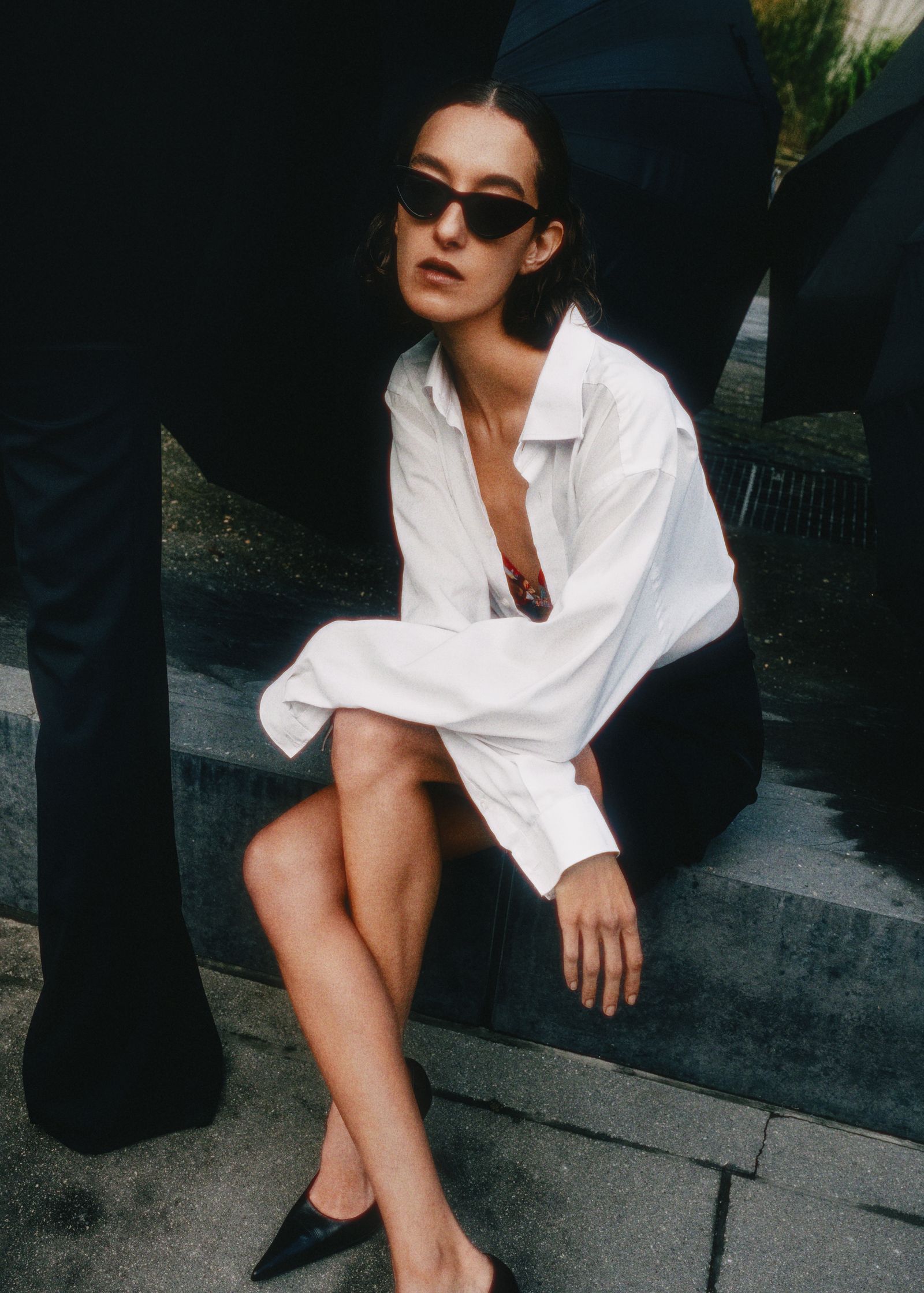 the woman is wearing a white shirt