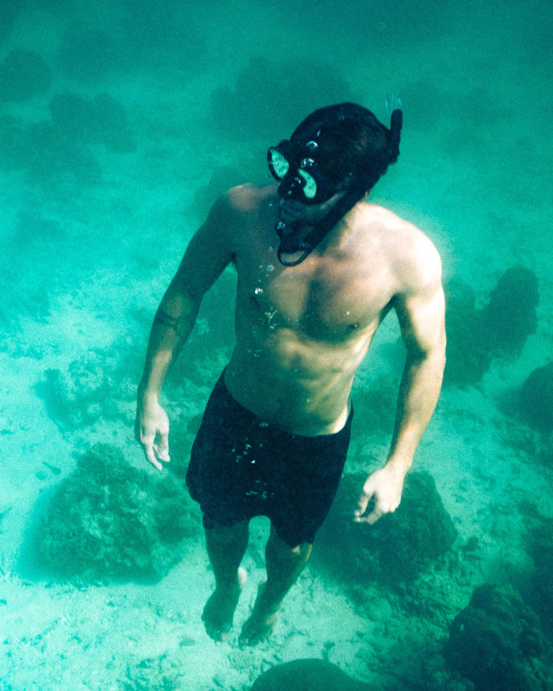 A man freediving in the sea of Koh Tao.