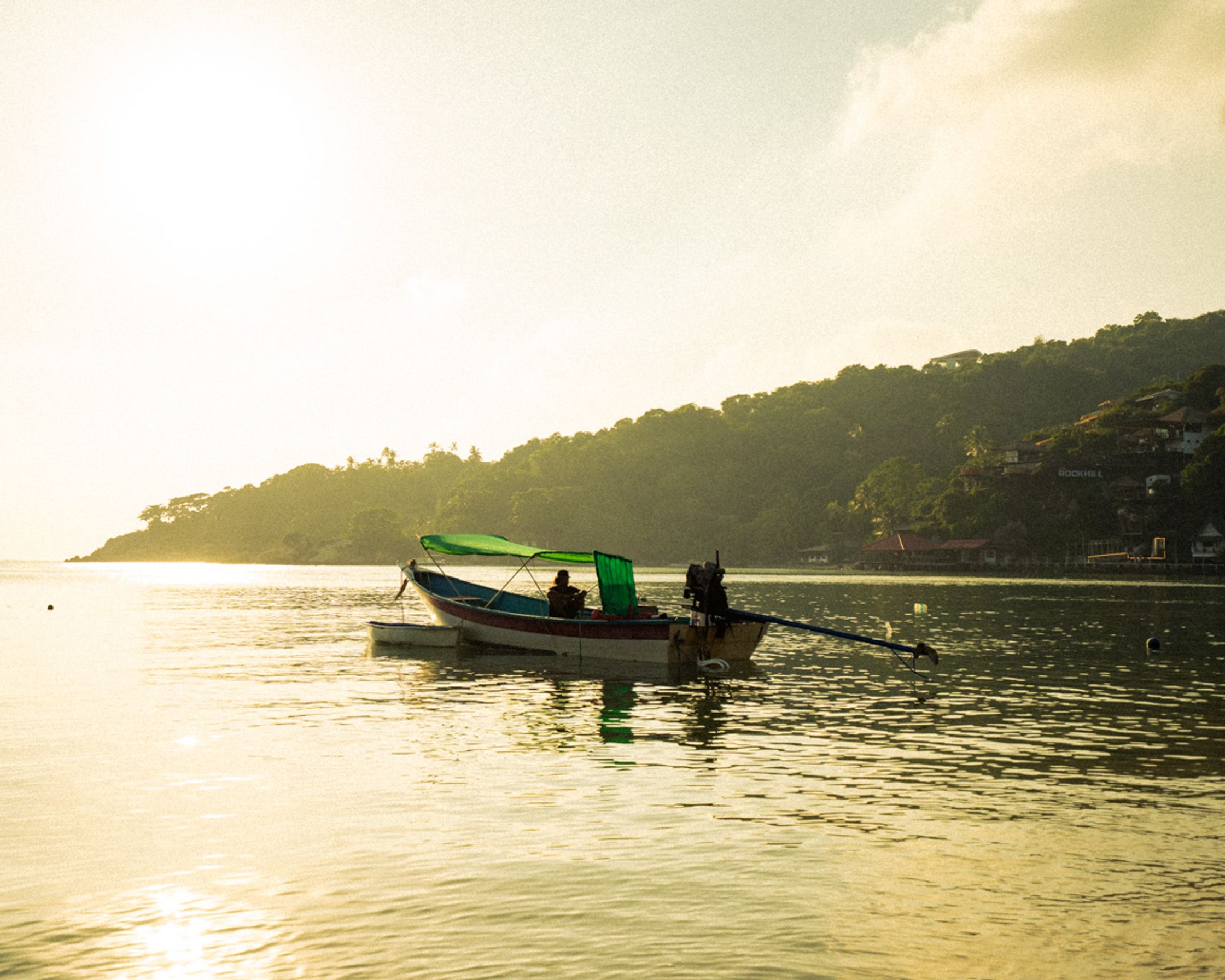 Traditional wooden boat from Koh Tao during the sunset.