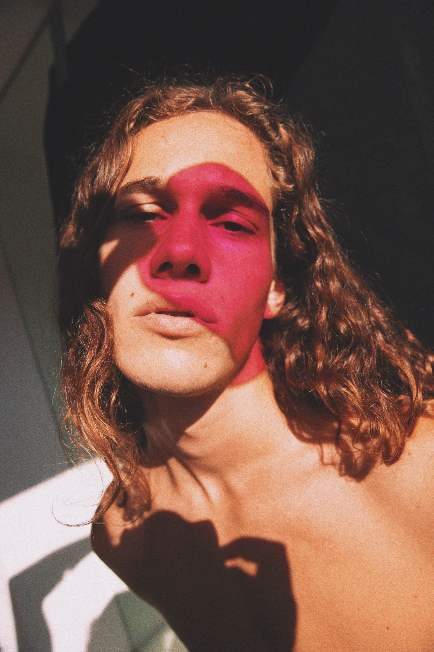 a man with pink paint on his face, portrait by Martin Kula