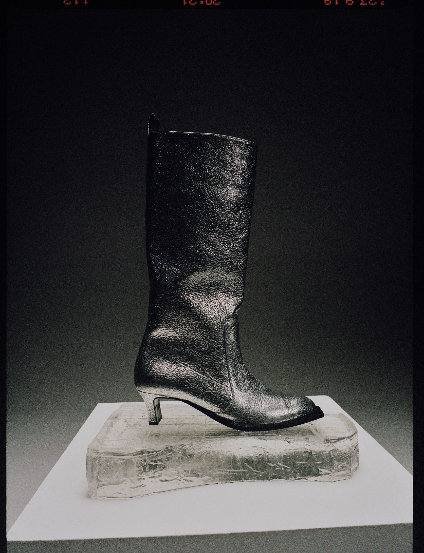 an image of a black boot on top of a book