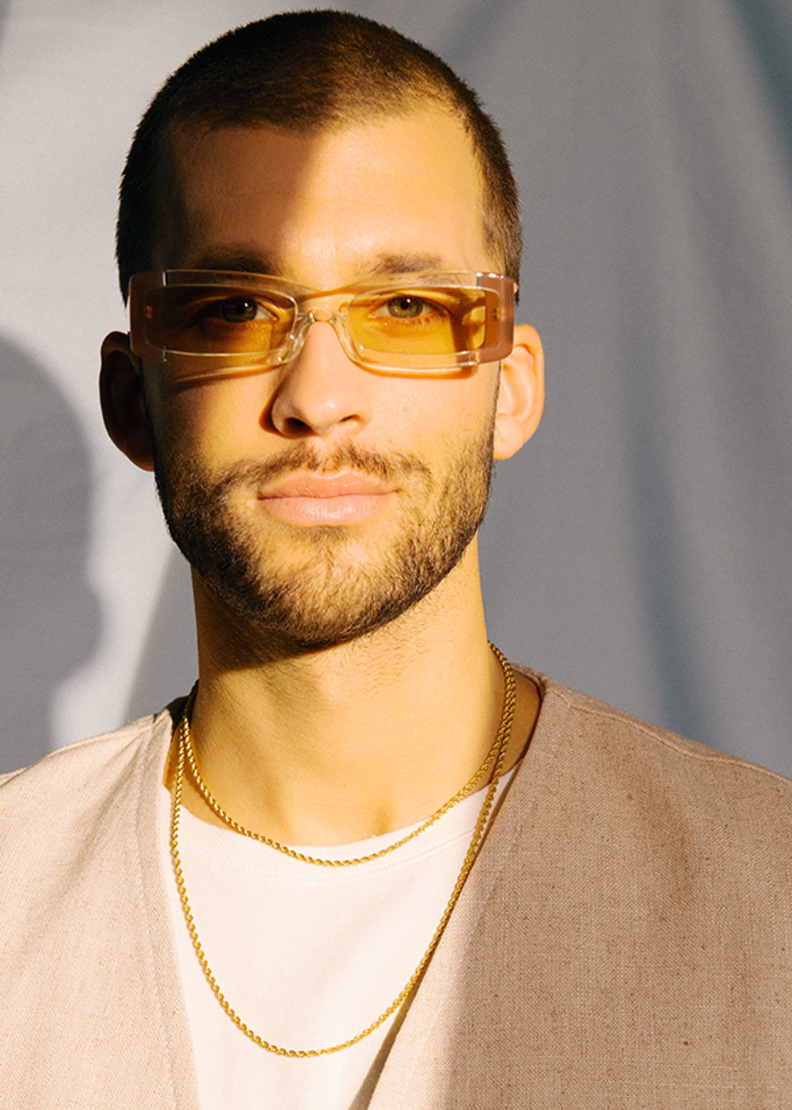 a man wearing sunglasses and a t-shirt