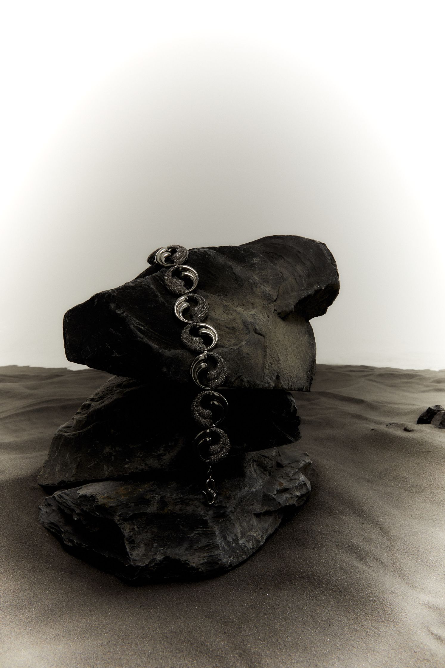 a rock with a chain on top of it