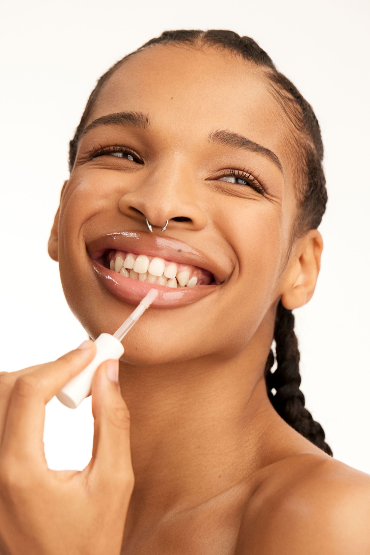 a woman is brushing her teeth